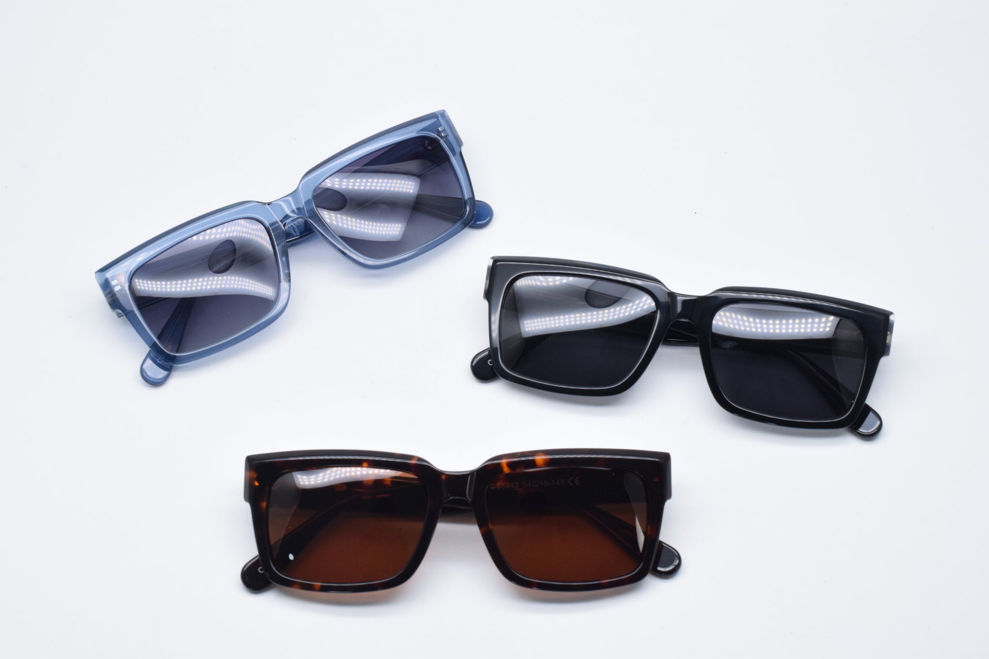 Gafas de sol unisex polarizadas con protección UV, fabricadas en material resistente de acetato.