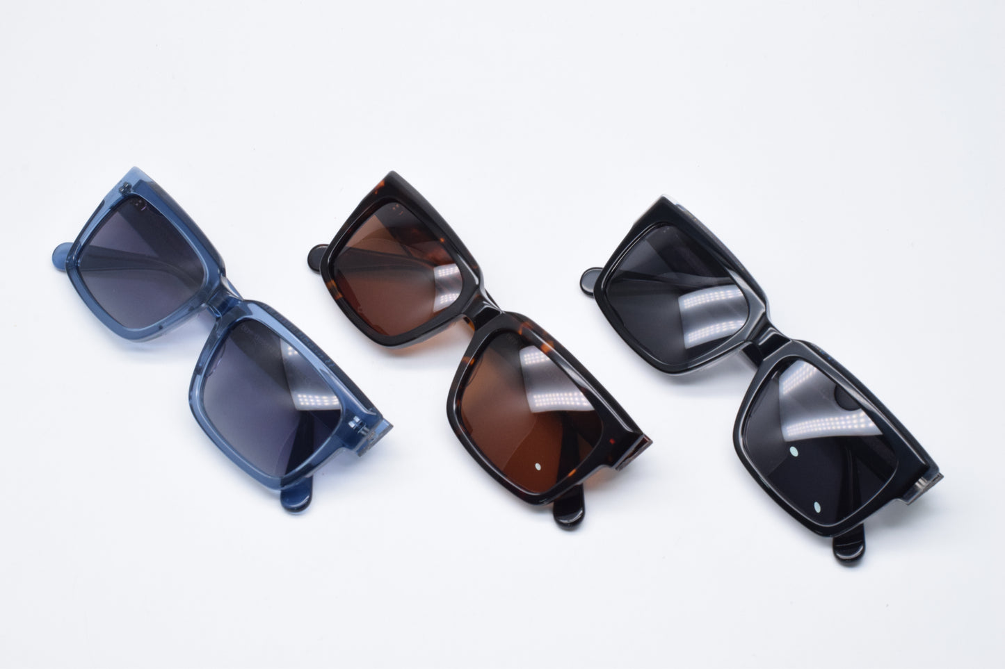 Gafas de sol unisex polarizadas con protección UV, fabricadas en material resistente de acetato.